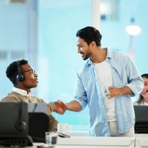 Call centre, man and handshake for teamwork in office for telecom, customer care and services. Dive