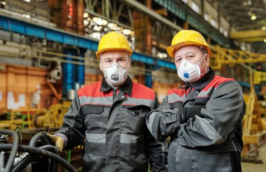 Two engineers in masks at work